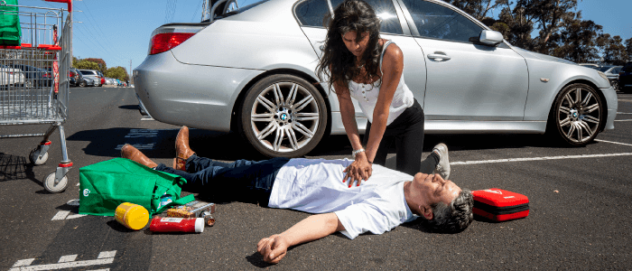 CPR first aid in the carpark