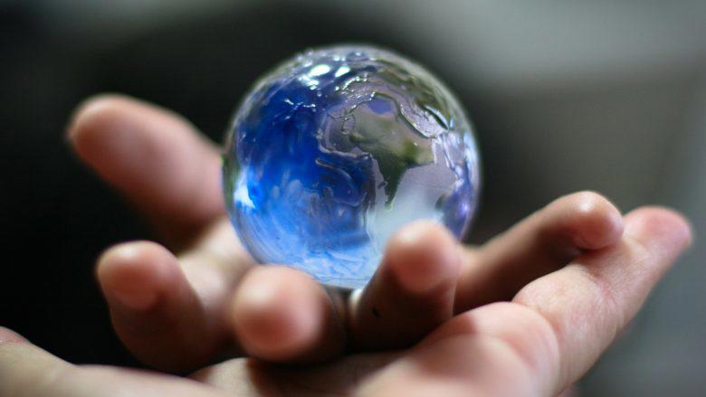 Hand holding Earth globe