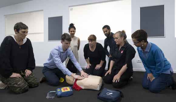 St John first aid training - trainer, students and manikin 