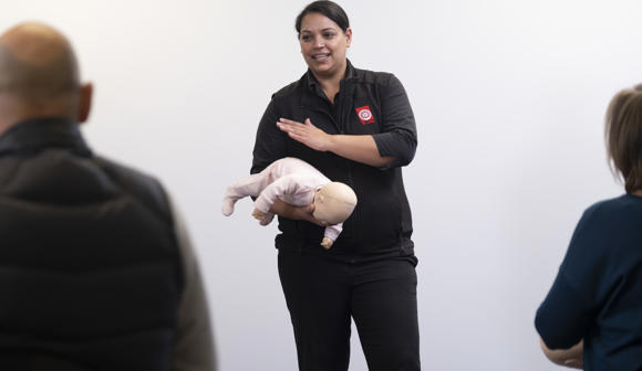 St John first aid trainer teaching baby first aid course