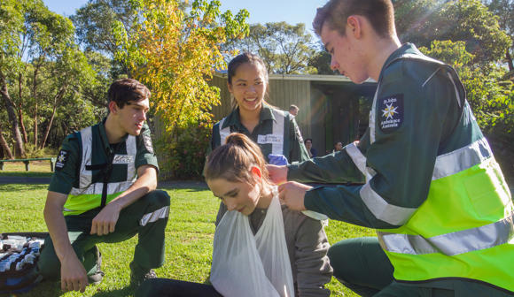 st john youth volunteers practicing first aid at camp