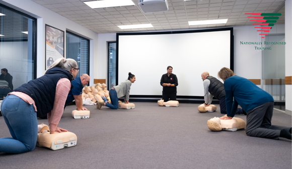 Group of first aid training participants socially distanced